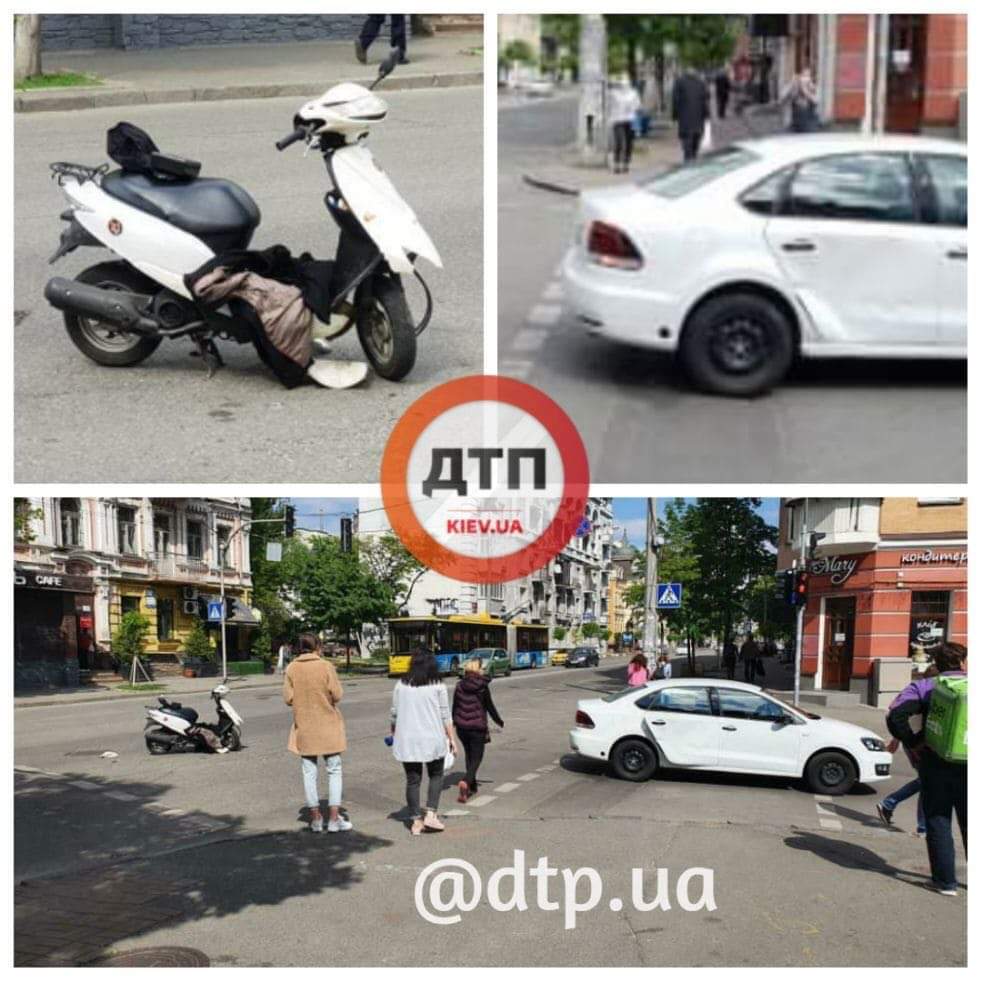 В Киеве на улице Артёма произошло мото ДТП - легковой автомобиль сбил курьера Uber Eats